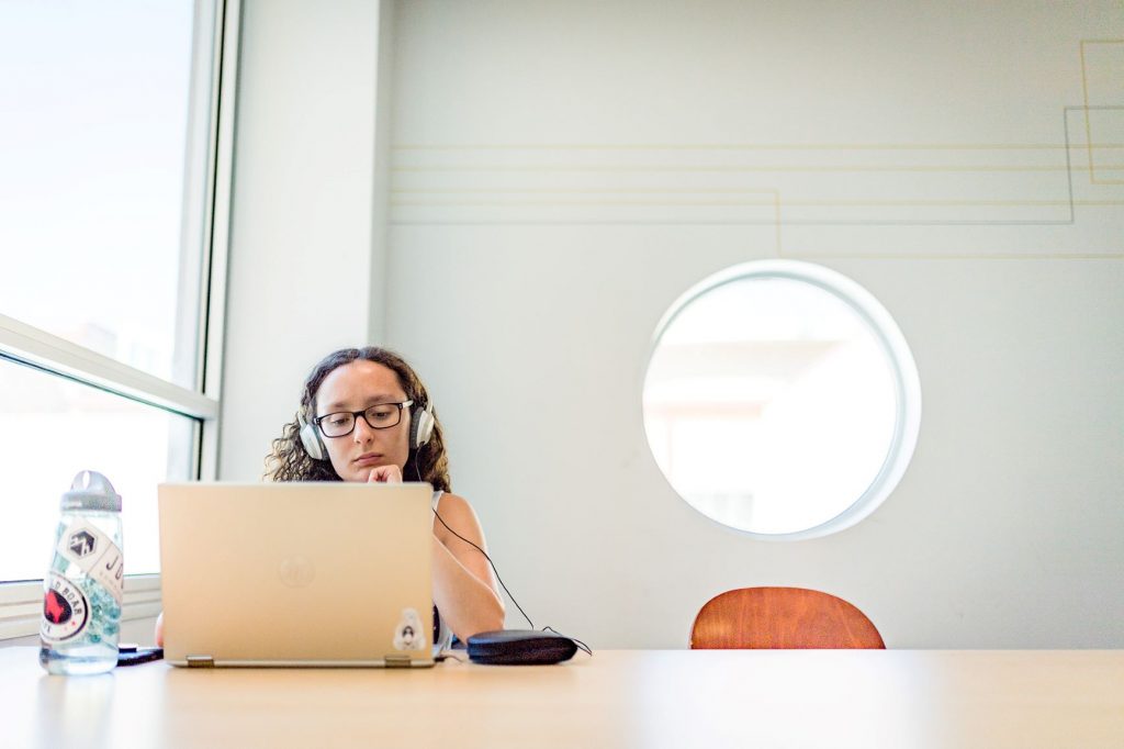 Photo of student looking at laptop computer